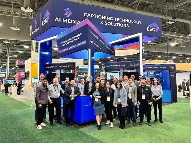 AI-Media and EEG team at a trade show showcasing AI-powered captioning technology and live automatic caption solutions.