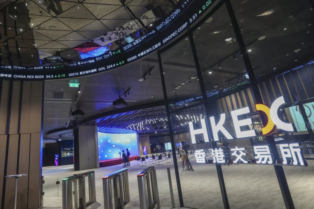 Interior view of Hong Kong Stock Exchange (HKEX) with digital ticker displays and HKEX signage