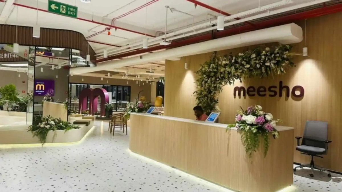 Reception area of Meesho office with modern interior design and floral decor in India