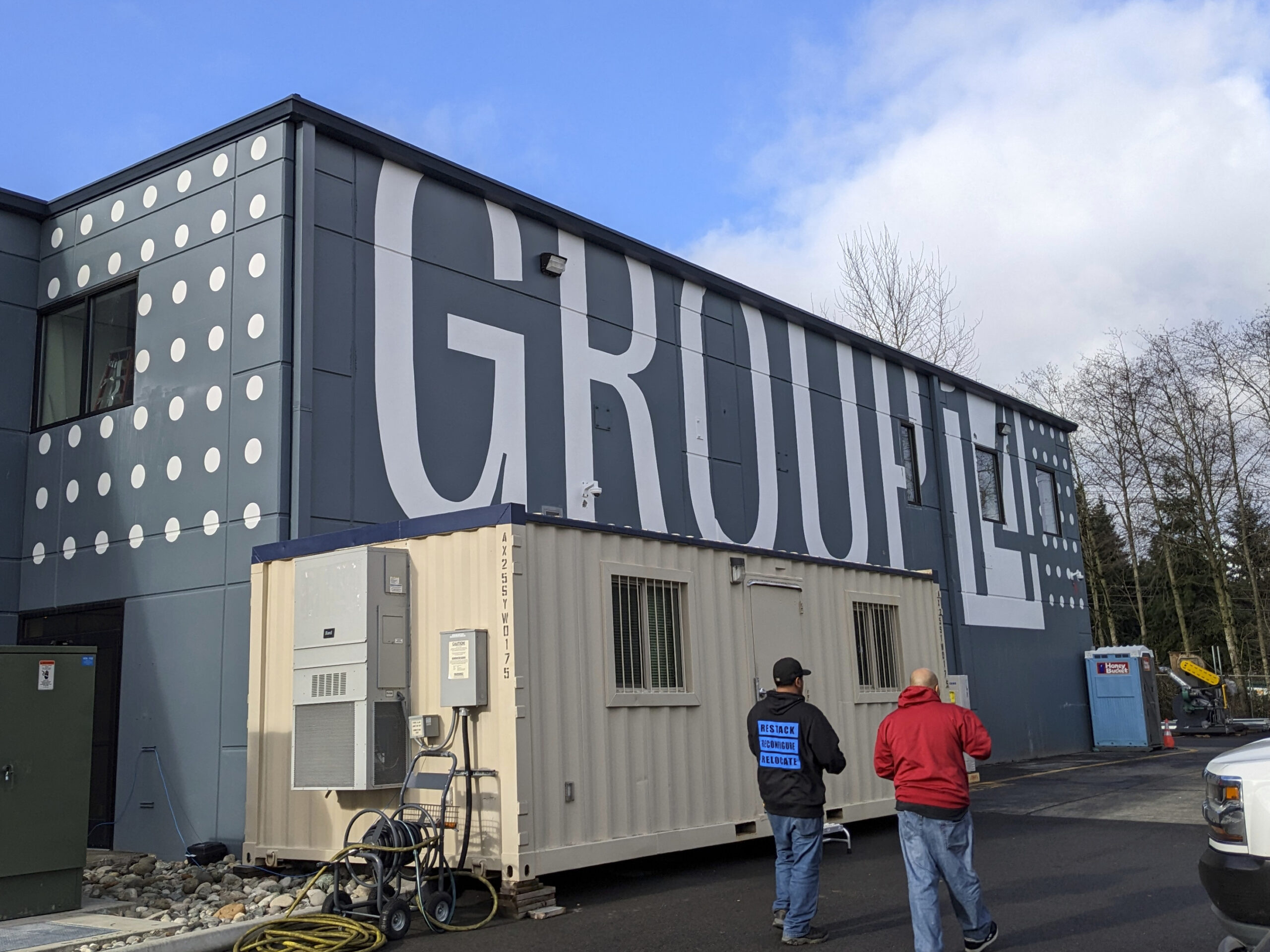 Group14 headquarters exterior with bold company branding on building facade, showcasing advanced battery technology and clean energy innovation.
