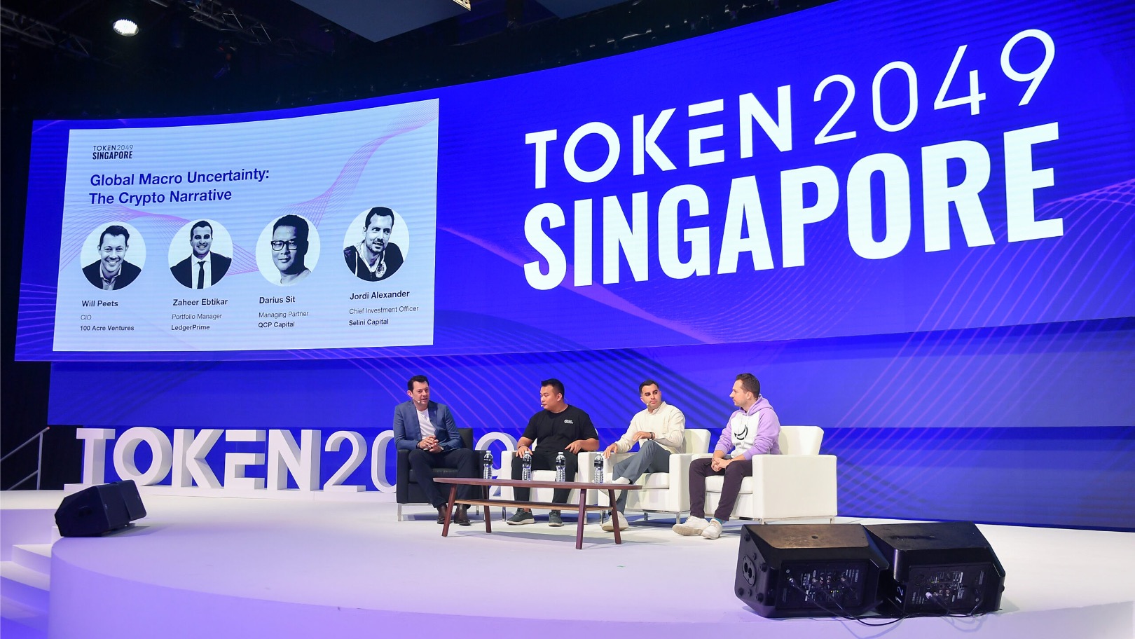 Panel discussion on global macro uncertainty and crypto narrative at Token2049 Singapore, featuring blockchain and investment leaders on stage.
