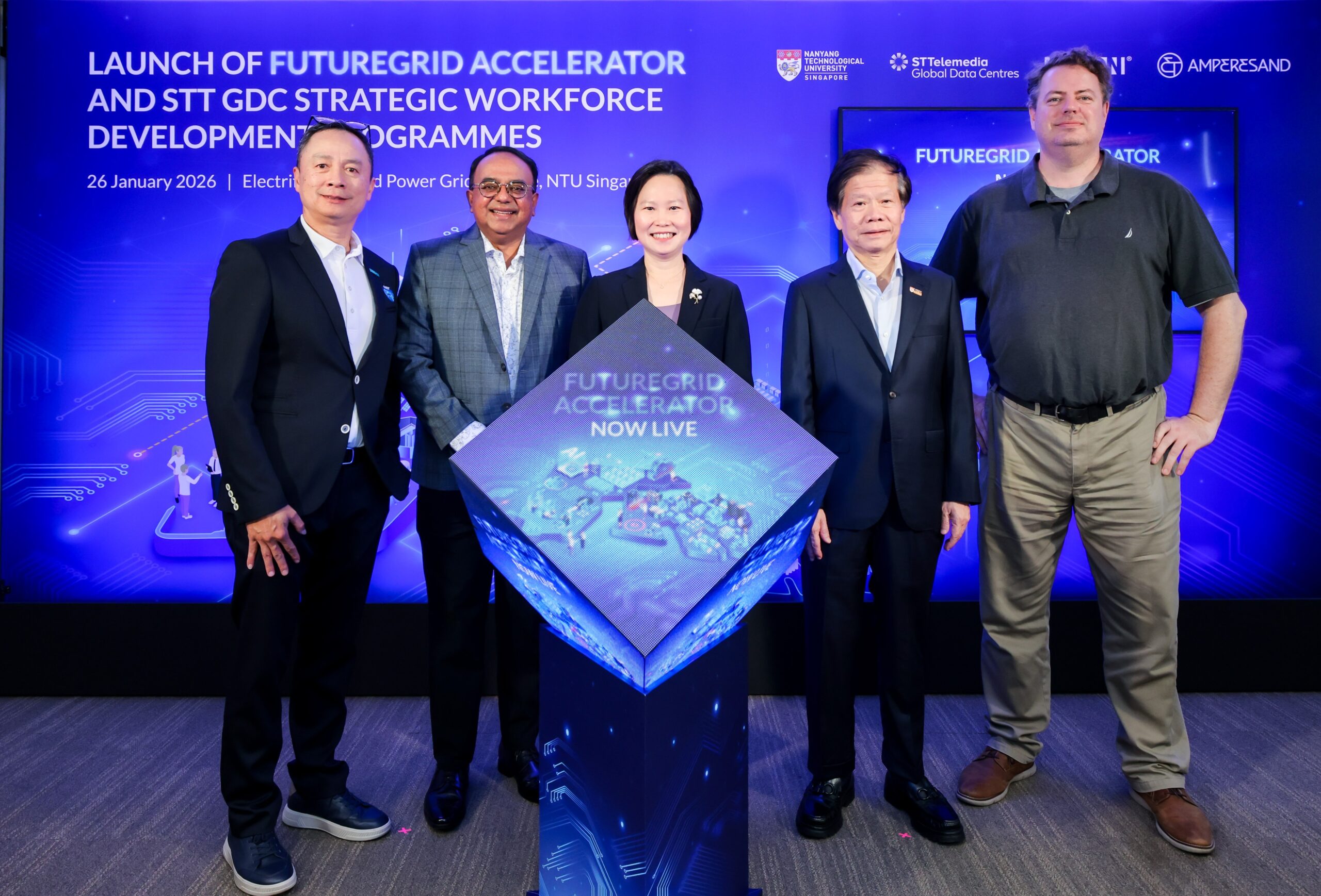 Leaders from NTU Singapore, ST Telemedia Global Data Centres, Ampersand, and industry partners pose at the launch of the FutureGrid Accelerator and strategic workforce development programmes in Singapore, highlighting collaboration on energy, power grid innovation, and digital infrastructure skills development.