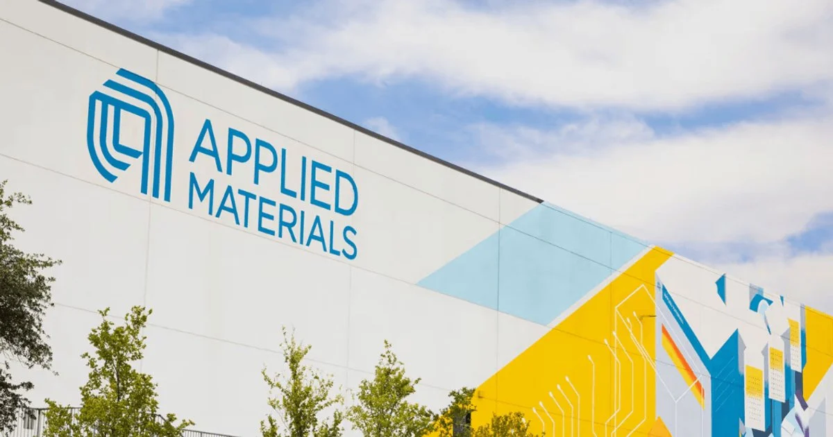 Applied Materials corporate office exterior with company logo displayed on modern semiconductor manufacturing facility building.