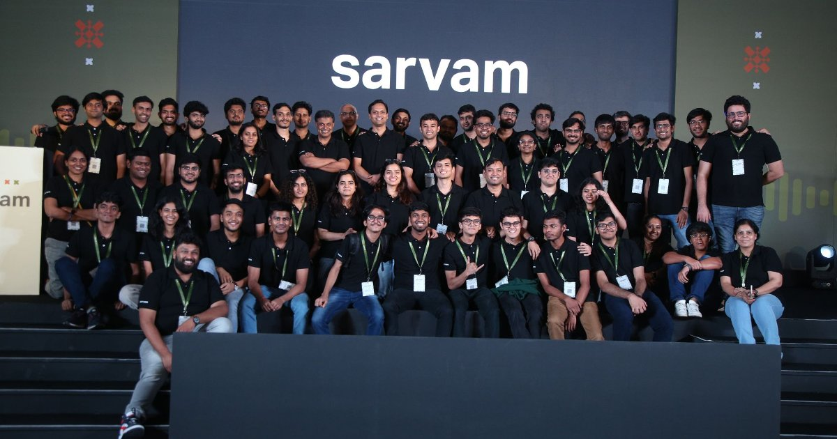Sarvam AI team posing on stage during a company event, highlighting the Indian artificial intelligence startup and its growing engineering and research workforce.