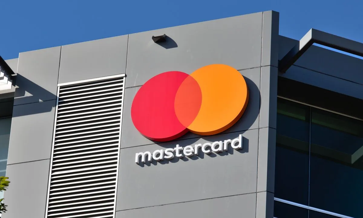 Mastercard logo displayed on corporate building exterior, representing global digital payments and financial technology services.