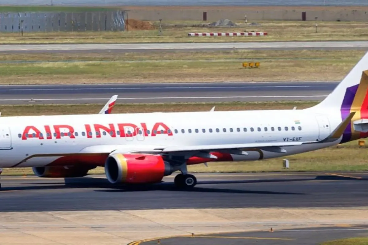 Air India passenger aircraft taxiing on the runway at an airport, representing India’s national airline and expanding aviation sector.