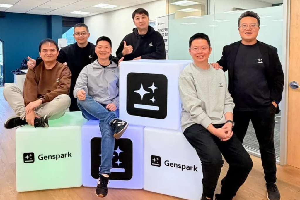 Genspark team posing in office with branded cubes, representing startup culture, AI technology innovation, and collaborative leadership in a modern workplace.