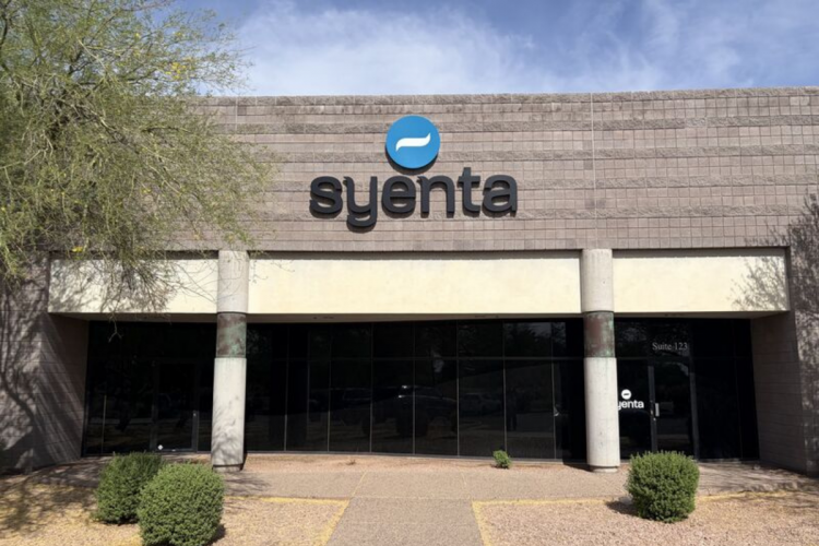 Syenta office building exterior with company logo signage, representing biotechnology, agricultural innovation, and global agritech industry presence.