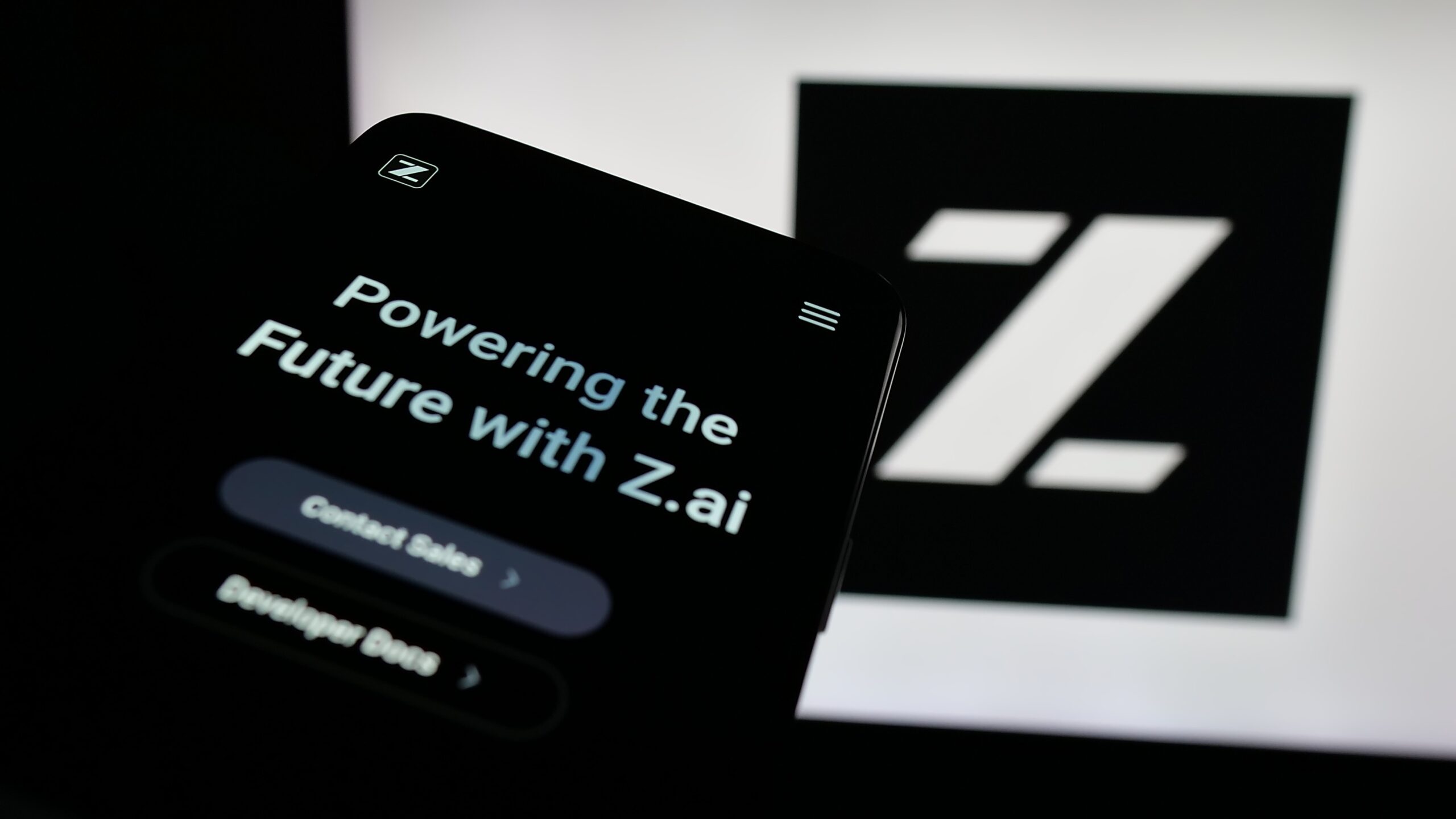 Z.ai platform displayed on smartphone screen highlighting AI innovation, digital transformation solutions, and enterprise technology branding.