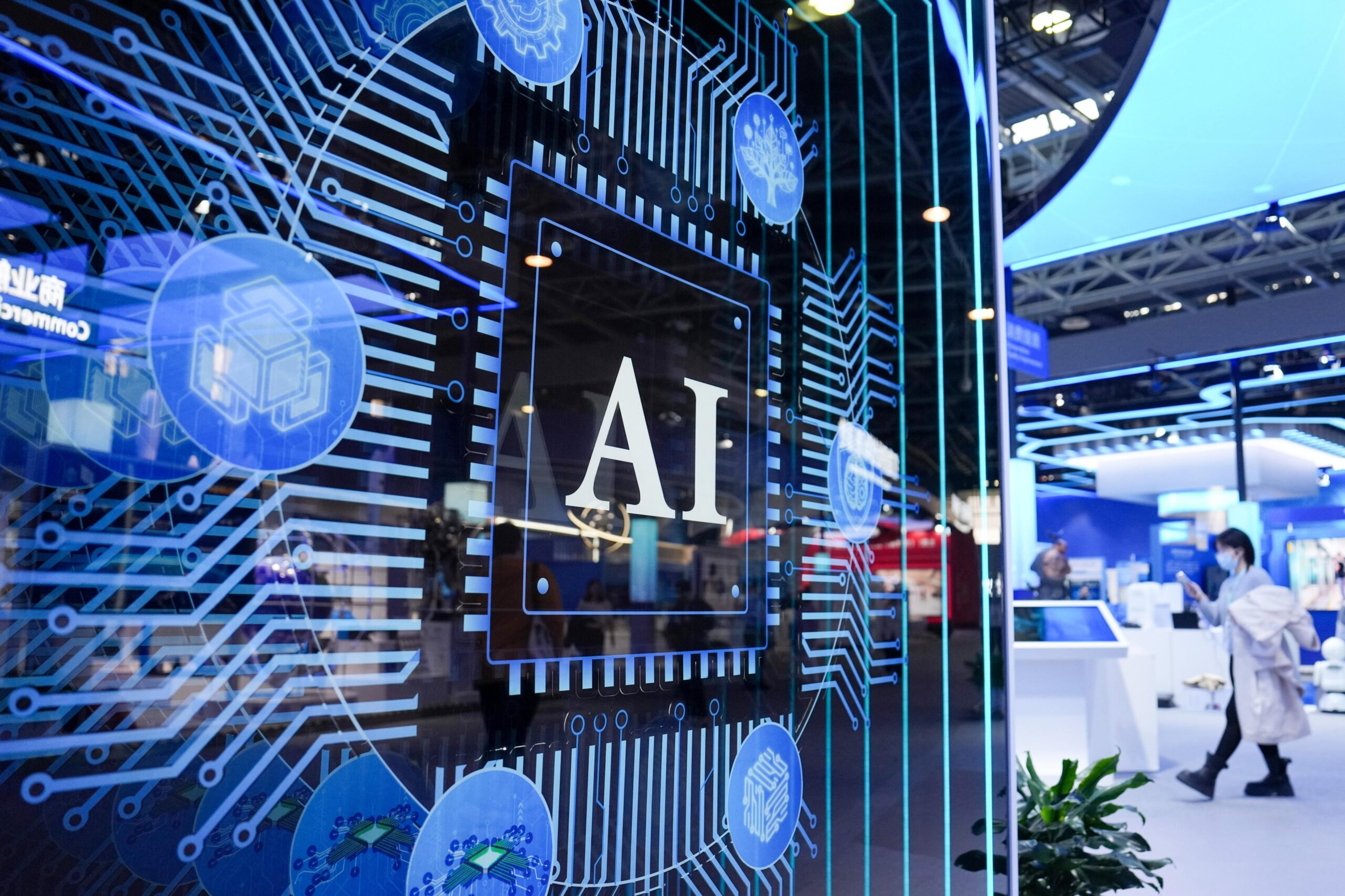 Artificial intelligence display panel with digital chip graphics and AI branding at a technology exhibition, highlighting machine learning, semiconductor innovation, and smart computing systems.