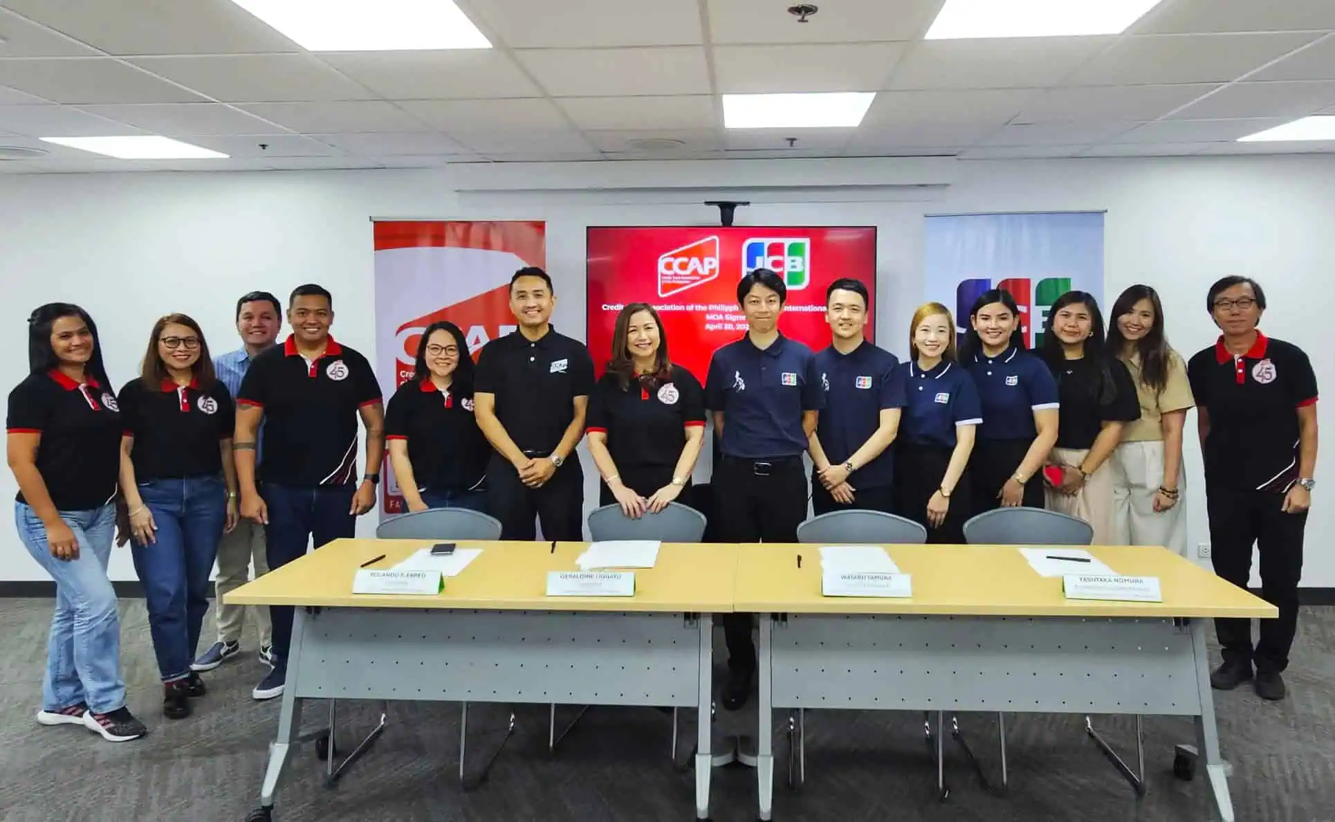 Representatives from CCAP and JCB posing during a partnership signing event in the Philippines, highlighting collaboration in digital payments, financial services, and fintech development.