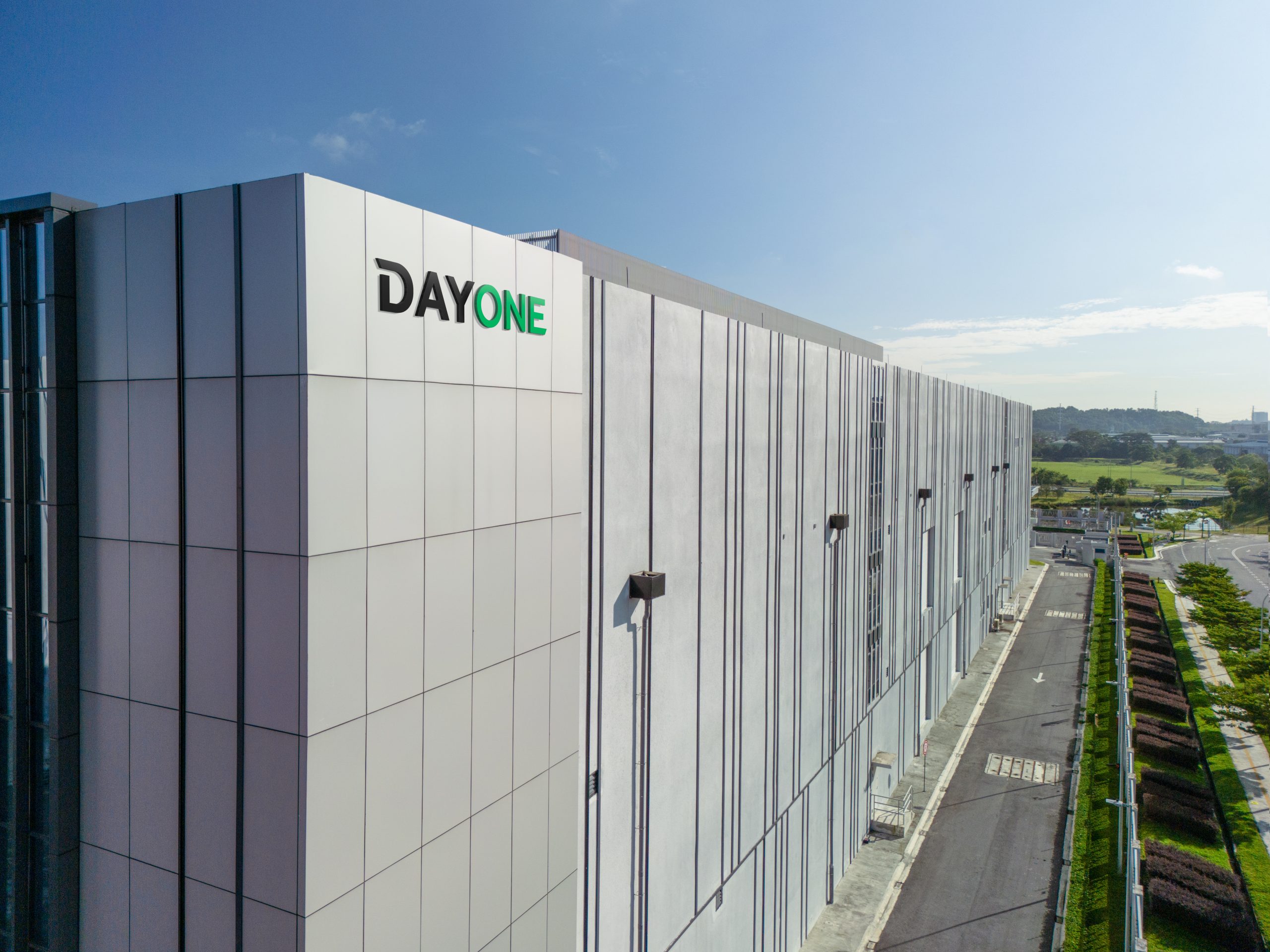 Modern DayOne data centre facility with glass-front architecture and landscaped surroundings, highlighting digital infrastructure growth, cloud computing expansion, and AI-driven data services in Asia.