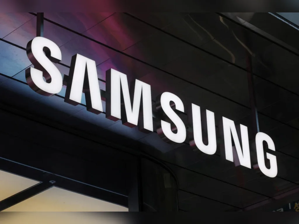 Samsung logo displayed on a modern corporate building exterior, representing the South Korean technology giant and its global electronics and semiconductor business operations.